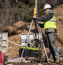 Hamill Concrete Employee Surveying Job Site